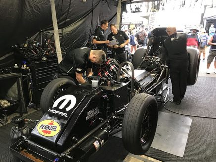 crew working on ron capps' funny car