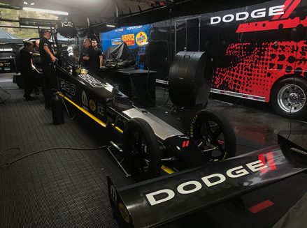 leah pritchett's crew team working on her top fuel dragster