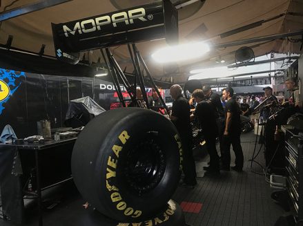 leah pritchett's crew team working on her top fuel dragster