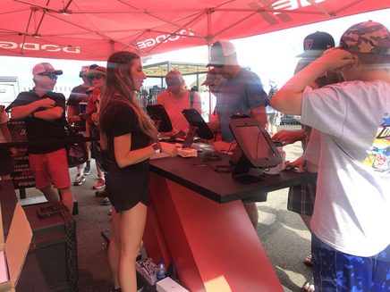 people signing up at a booth