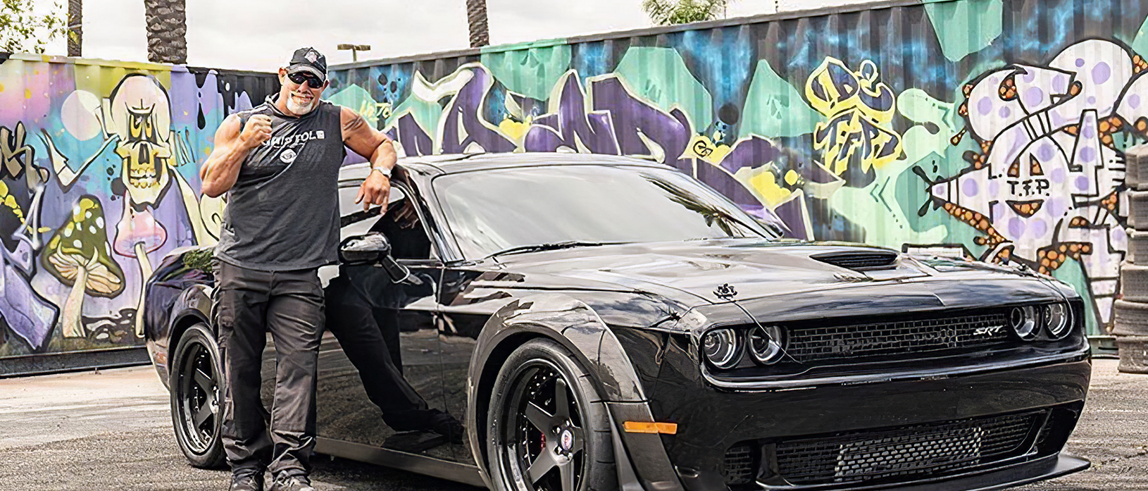 Bill Goldberg standing in front of his Demon