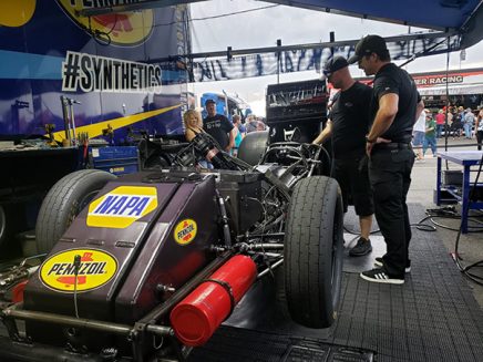 crew working on ron capps' funny car