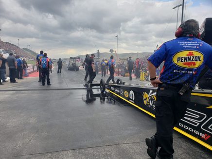 leah pritchett's top fuel dragster at the starting line of the drag strip