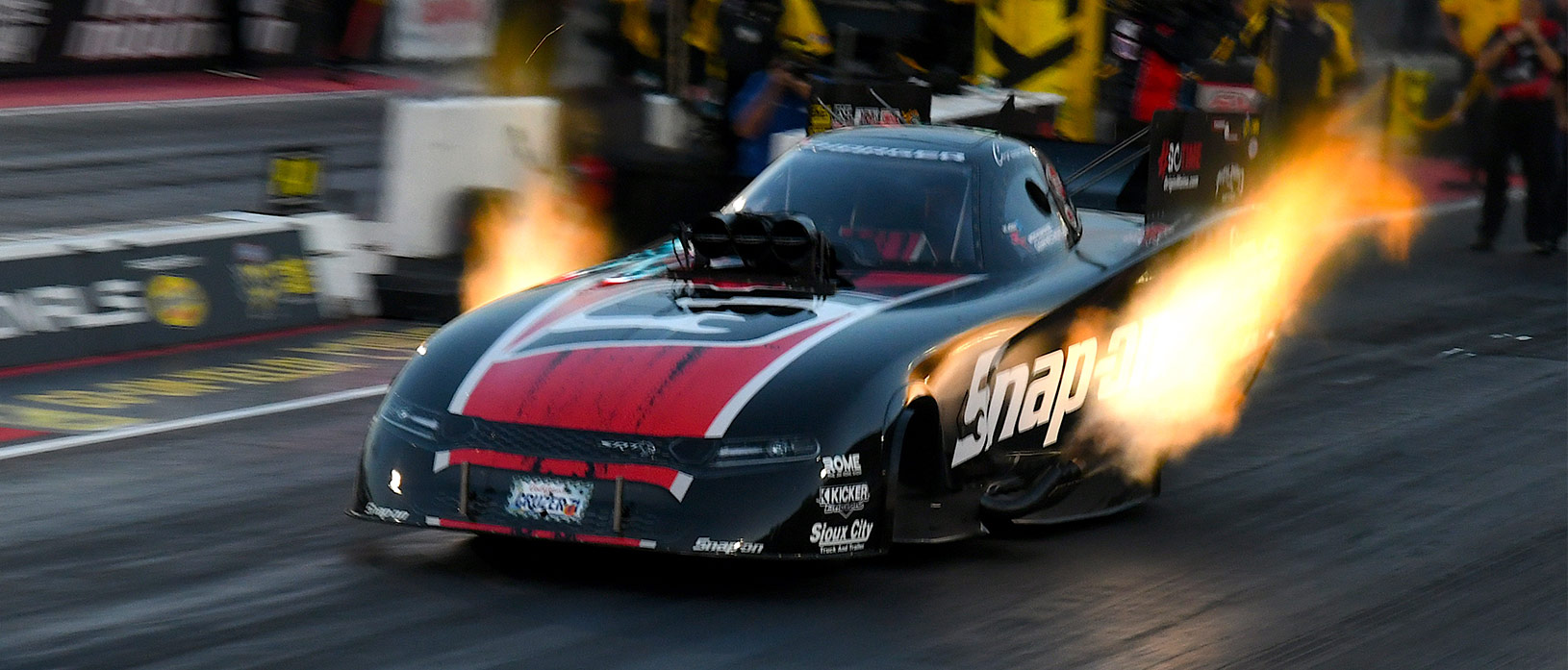 dodge charger srt hellcat funny car going down the drag strip