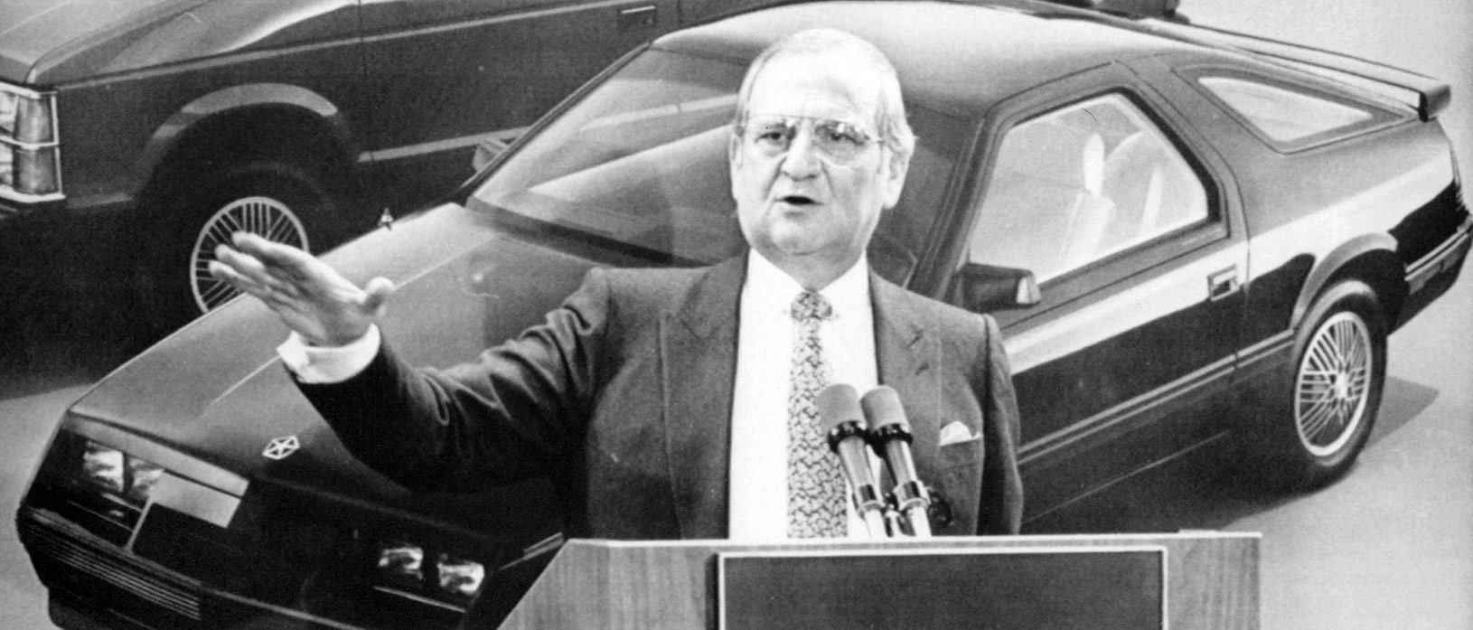 lee iaccoca speaking on a podium