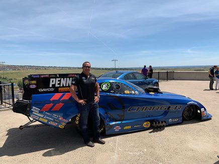 matt hagan standing next to his 2020 dodge charger srt hellcat widebody funny car