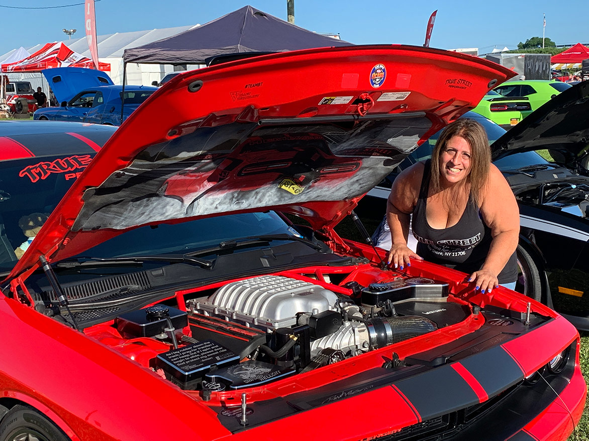 Woman with her 2015 Dodge Challenger SRT® 392