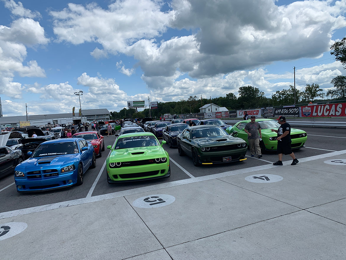 many dodge vehicles parked outside