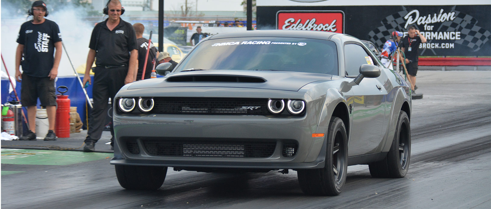 dodge vehicle on the starting line of a drag strip