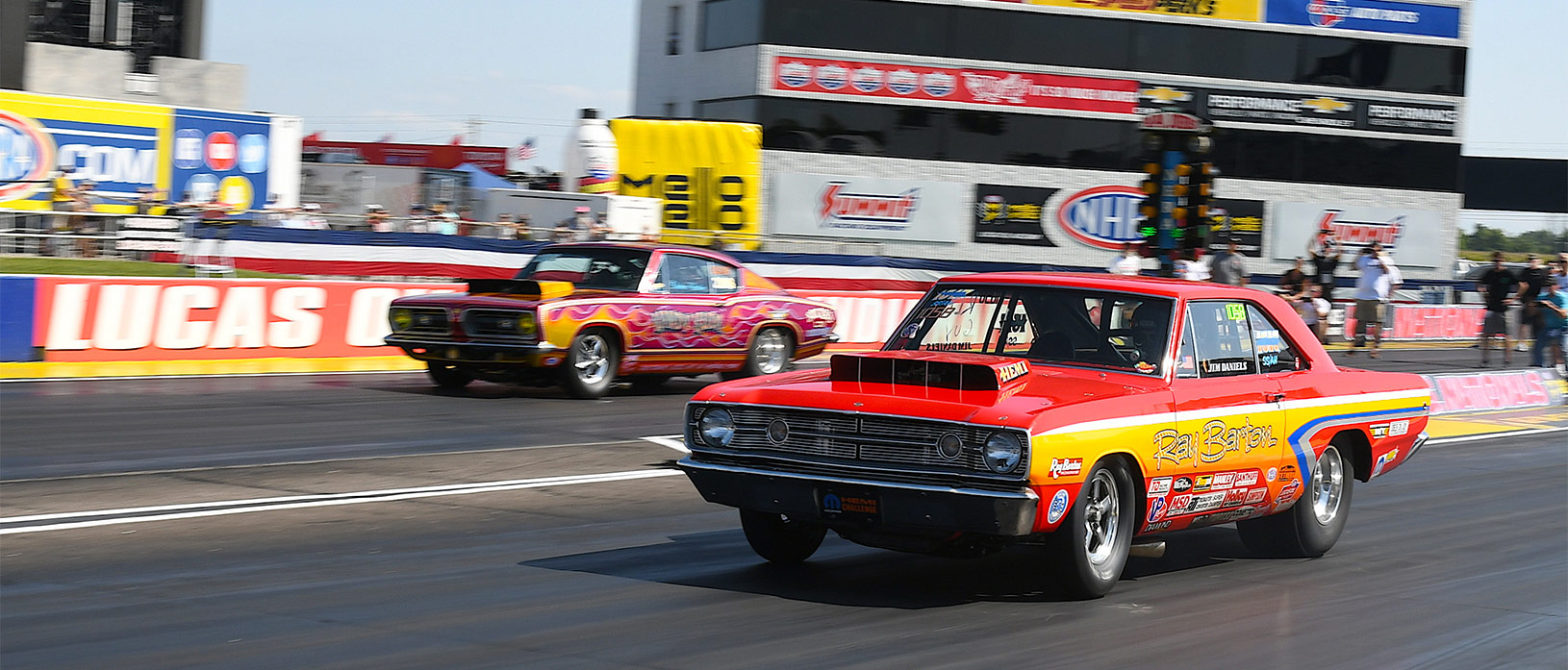 dodge vehicles at the starting line of a drag strip