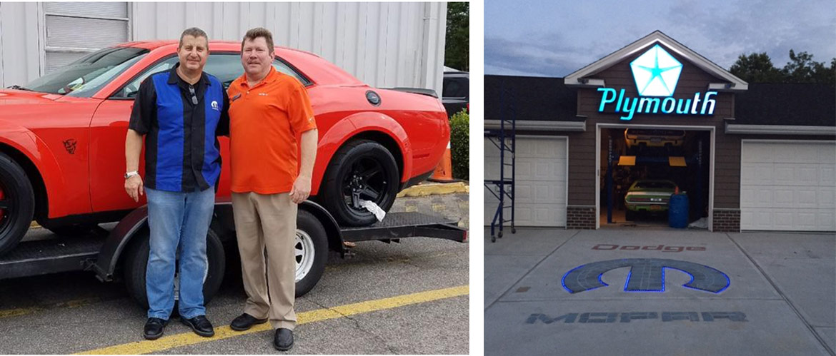 two men standing next to a mopar vehicle and a mopar garage