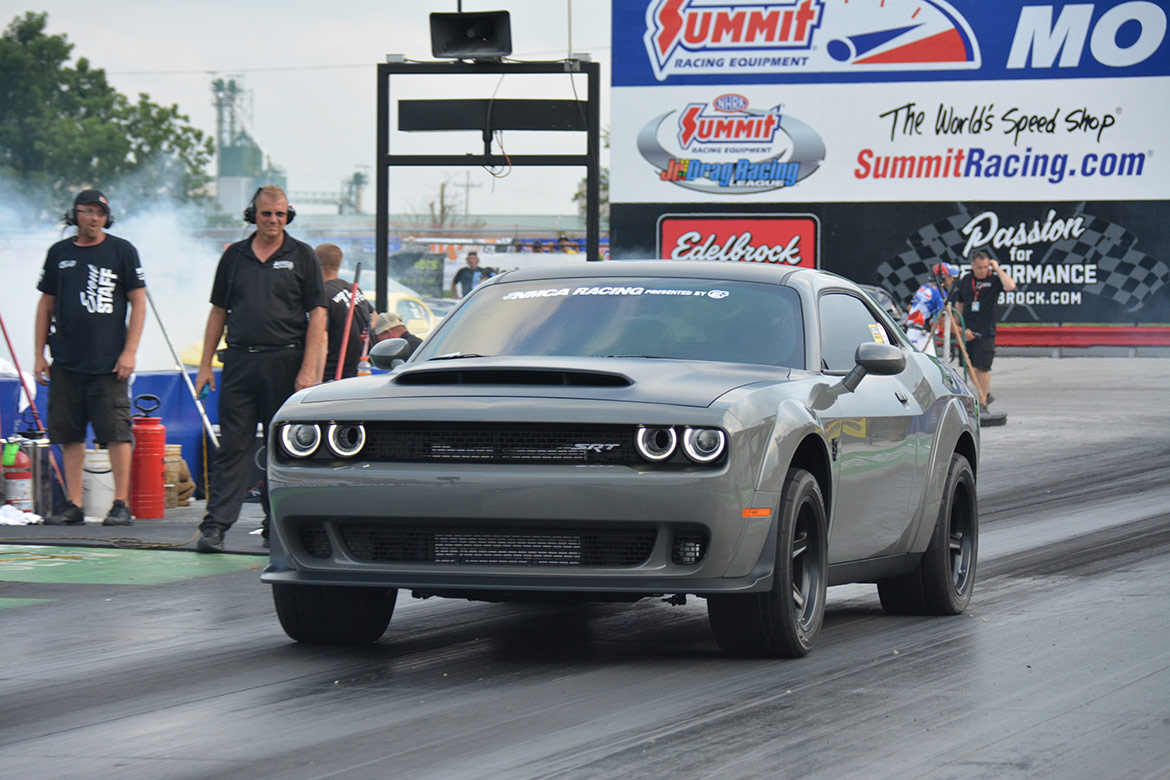 dodge vehicle on the starting line of a drag strip