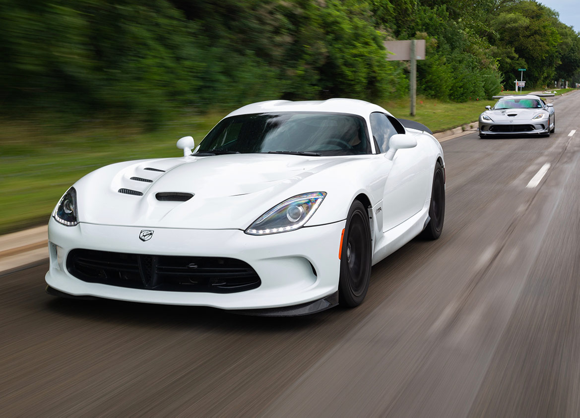 two Viper ACR-e vehicles driving down the road