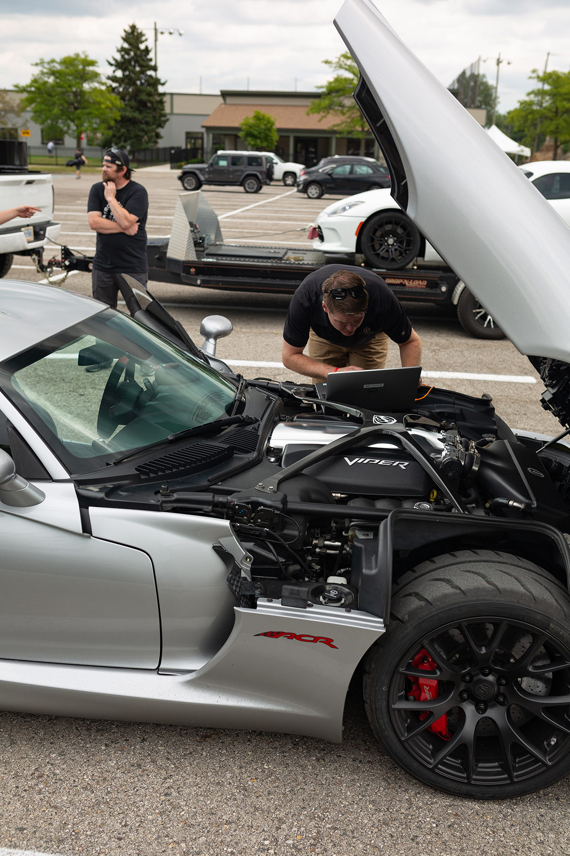 man looking in a Dodge Viper ACRe 