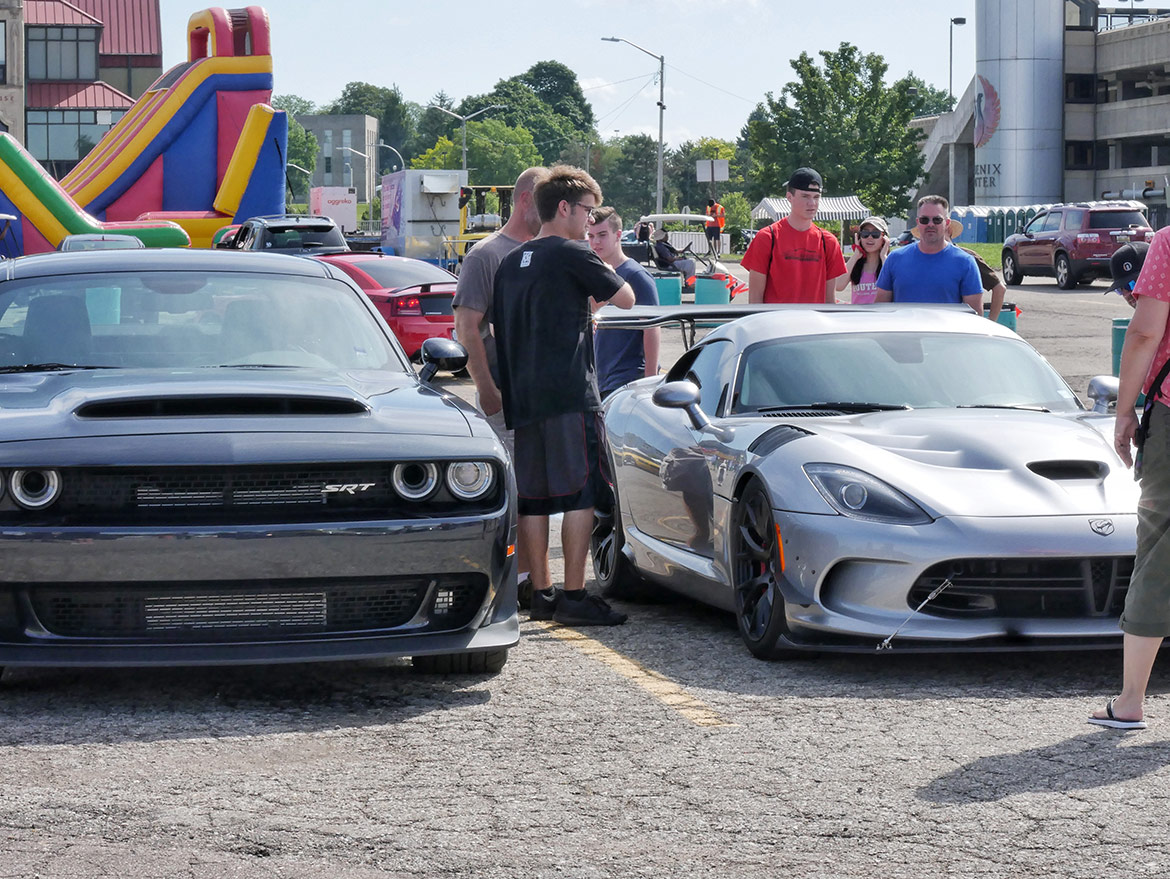 enthusiasts looking at dodge vehicles