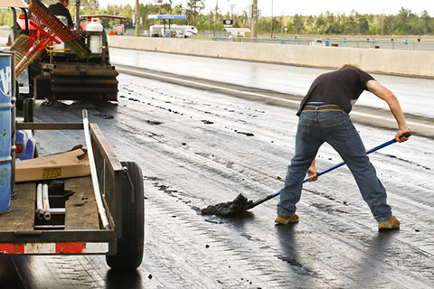 Man working on a drag strip