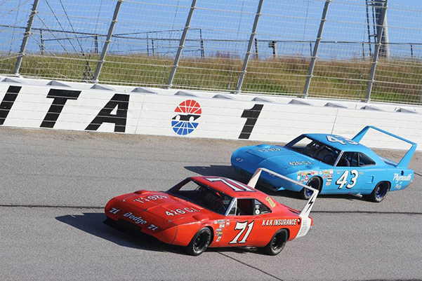 two vehicles on a race track