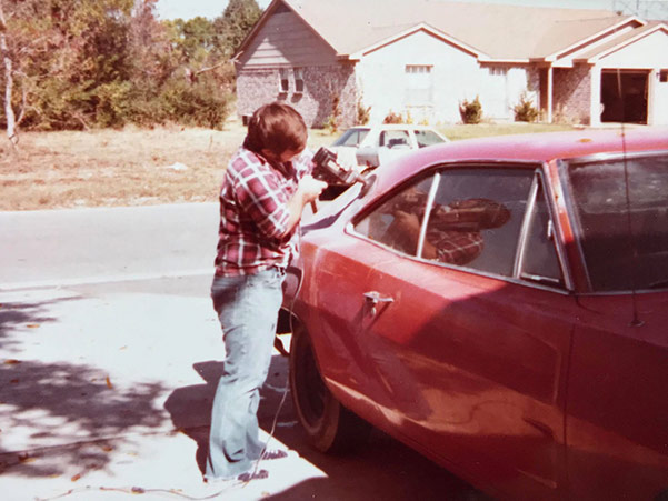 Man working on a dodge vehicle