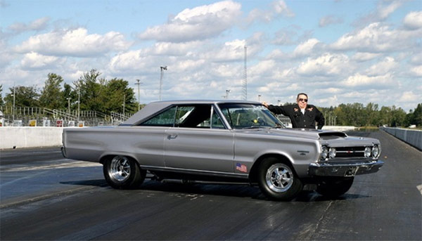 man with a dodge vehicle