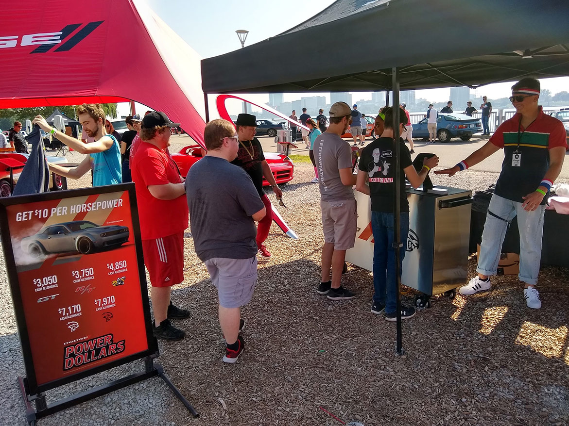 people engaging with the dodge brand display