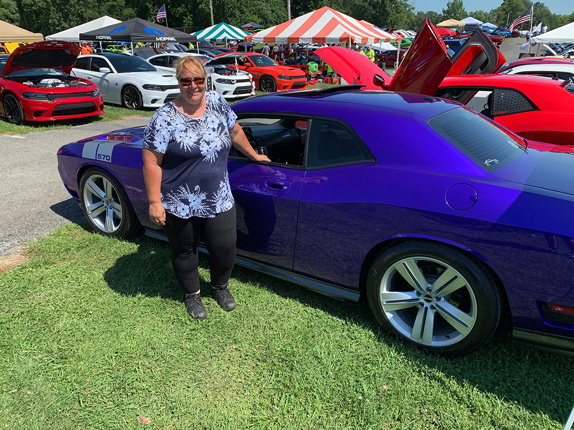 woman with her dodge vehicle