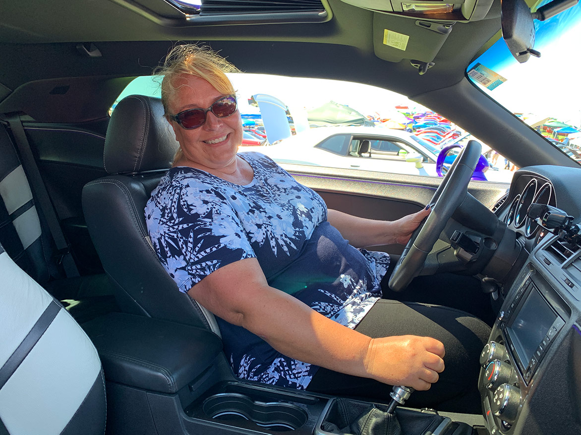 woman in the driver's seat of her dodge vehicle