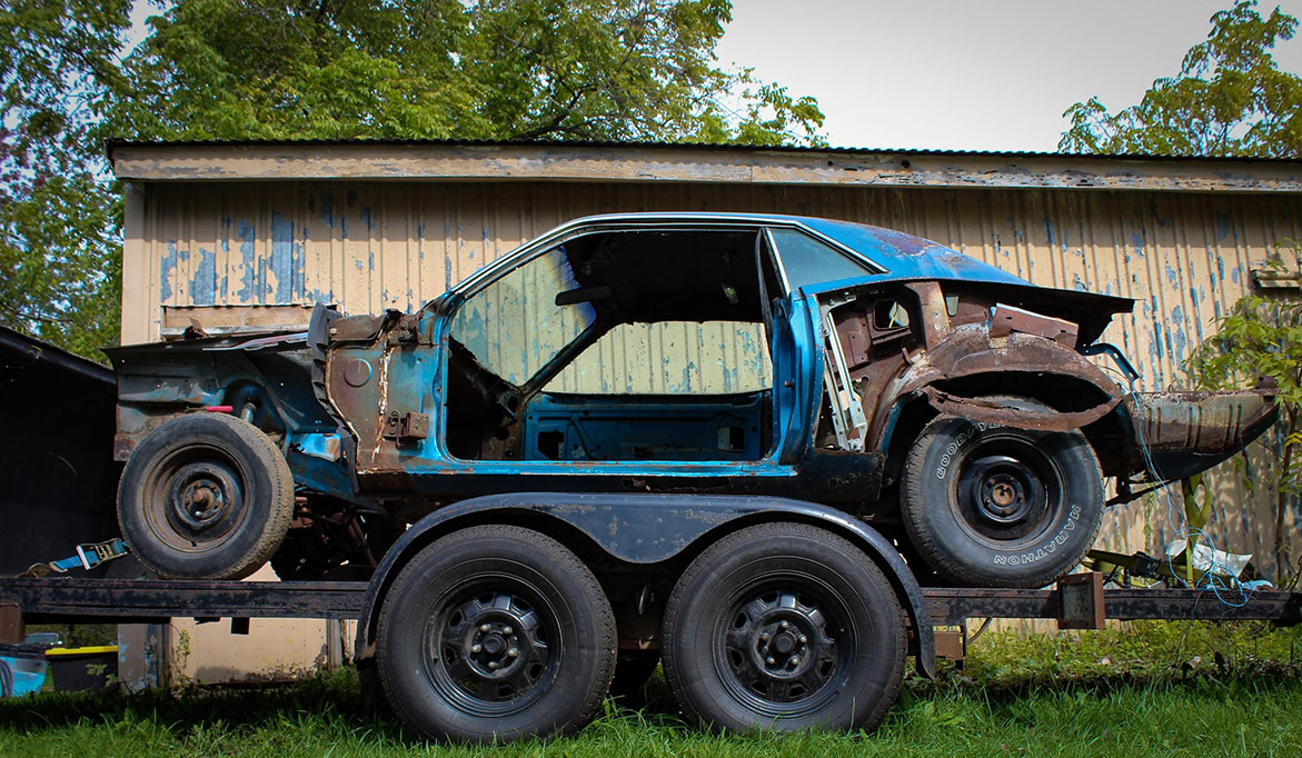 decrepit plymouth vehicle