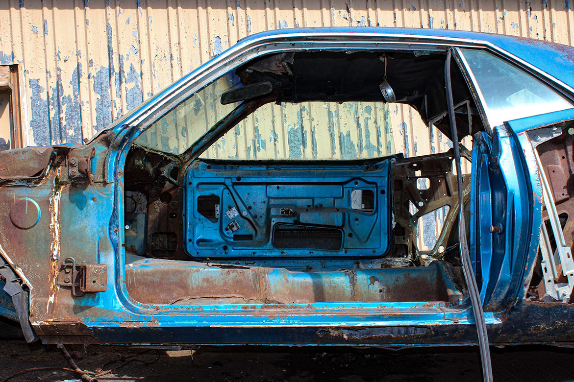 decrepit plymouth vehicle body