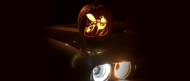 Scat pack pumpkin sitting on hood of scat pack