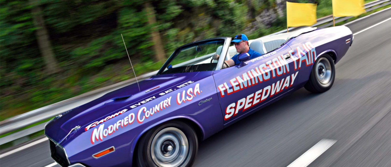 man driving a dodge vehicle