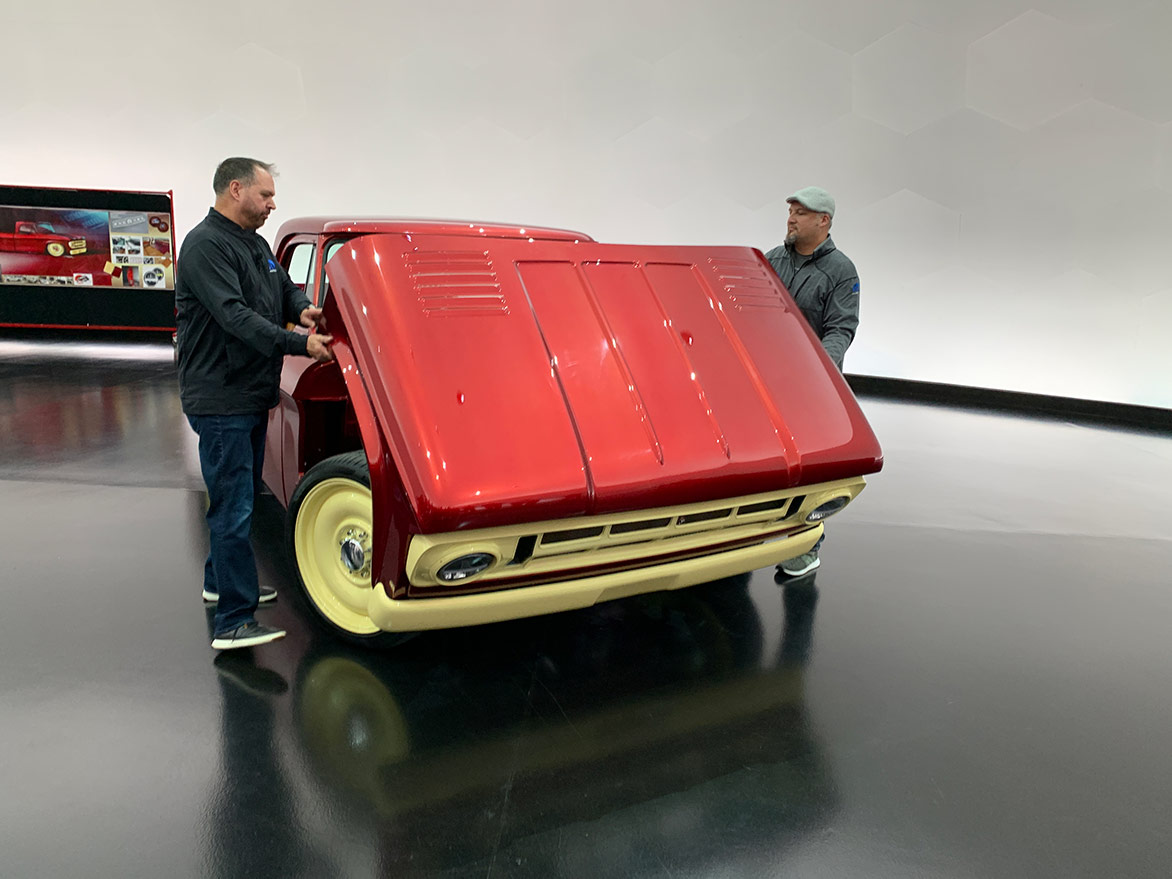 two men opening the hood of the Mopar® Dodge Lowliner Concept