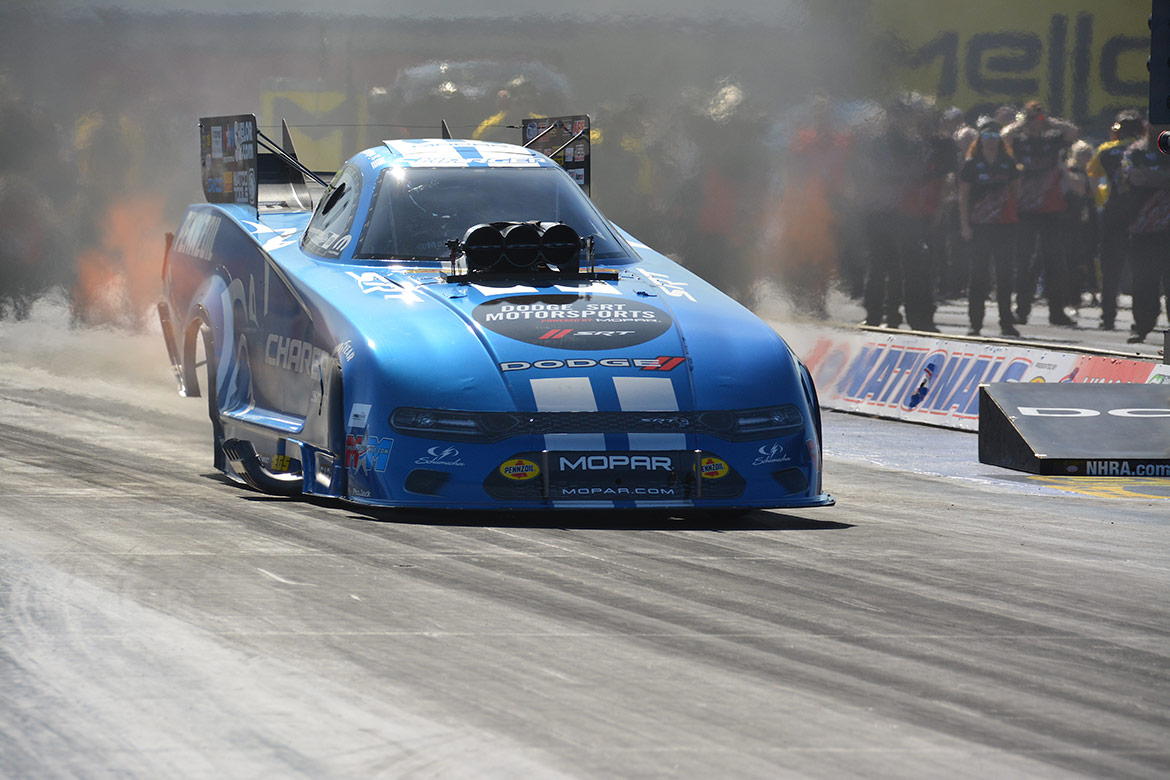 matt hagan's funny car on the starting line of a drag strip