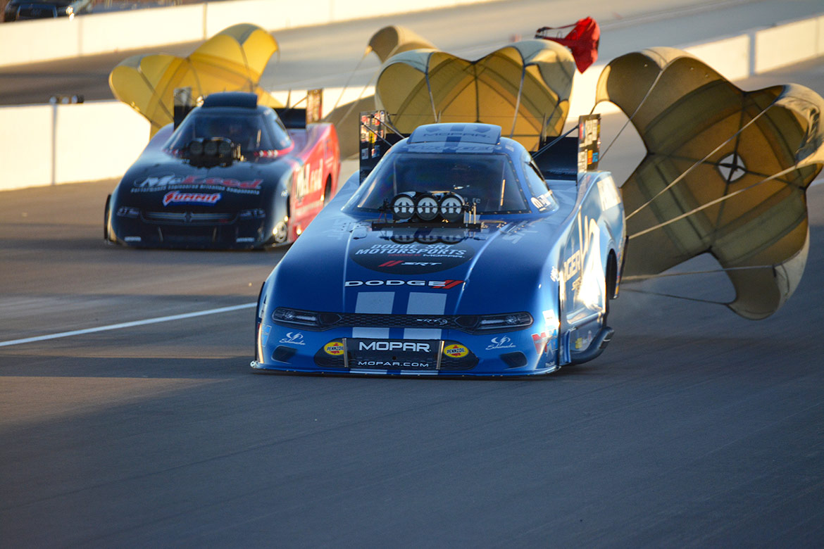 two funny cars drag racing