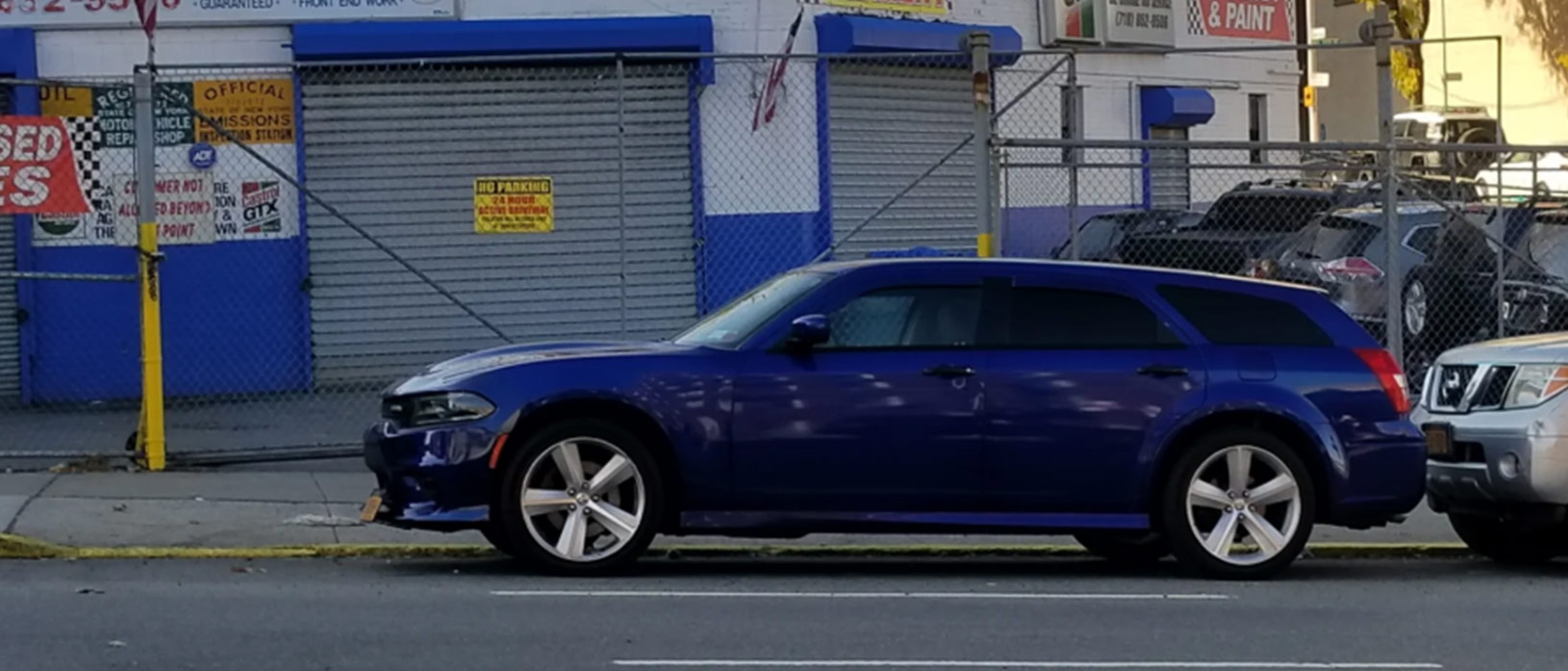 dodge magnum parked on the street