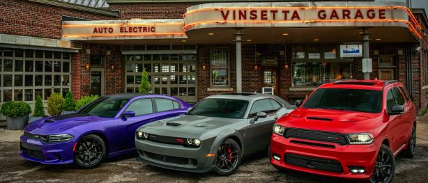 dodge challengers parked in front of vinsetta garage