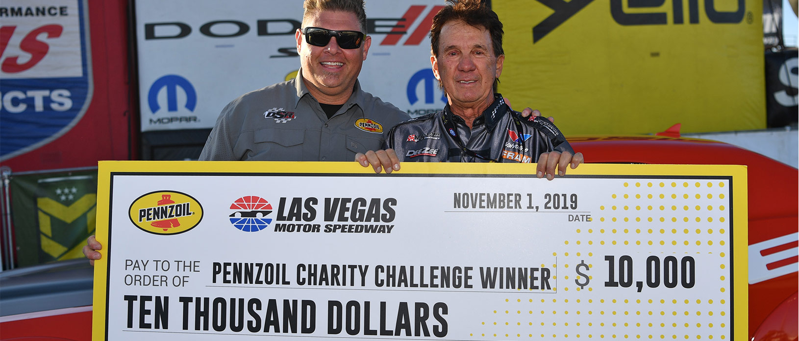 joe amato and a man holding a large check