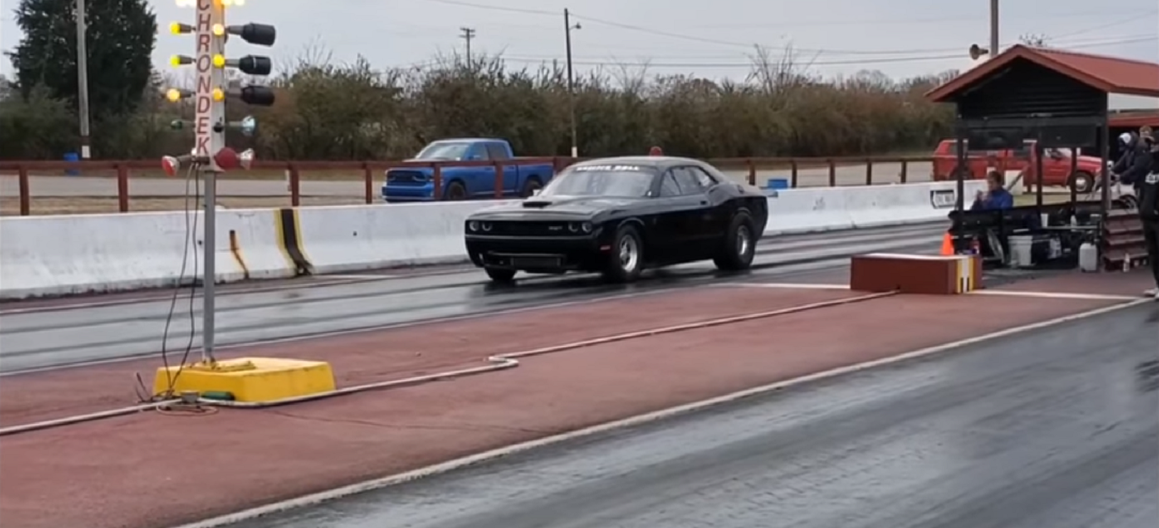 Challenger racing down the race track