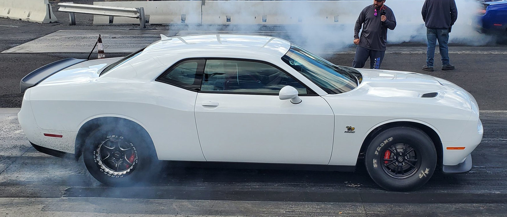 white challenger doing a burnout