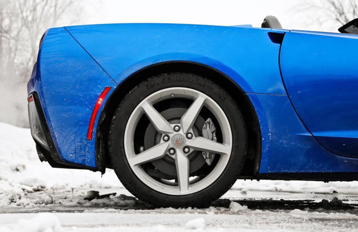 Blue convertible parked in snow