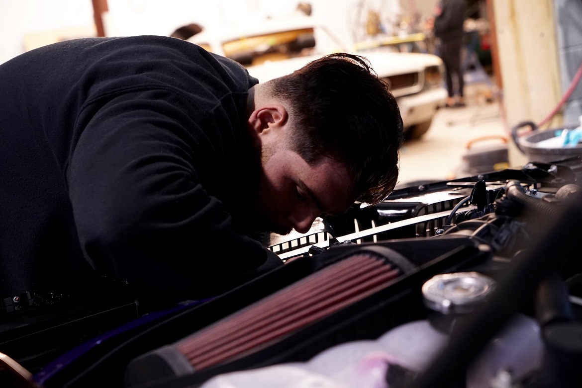 man working on engine