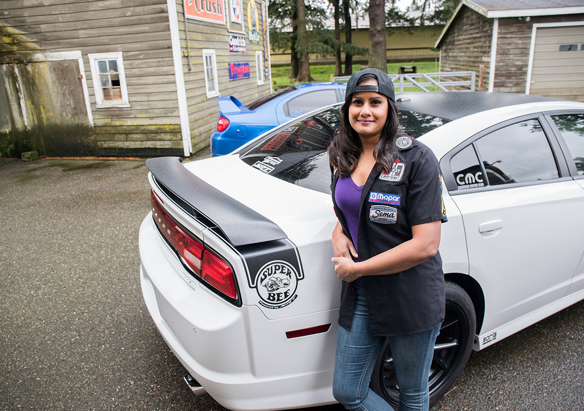 Jovita standing beside Dodge Charger Super Bee