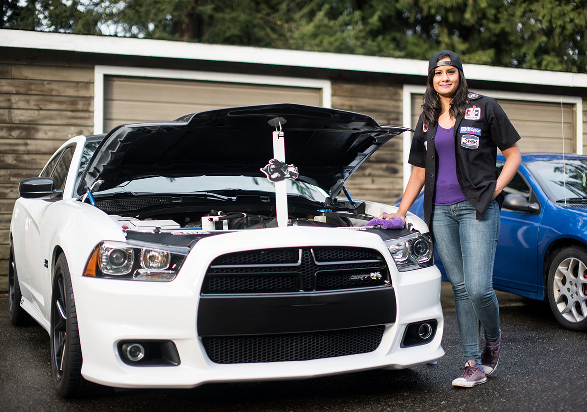 Jovita standing in front of her Dodge Charger Super Bee