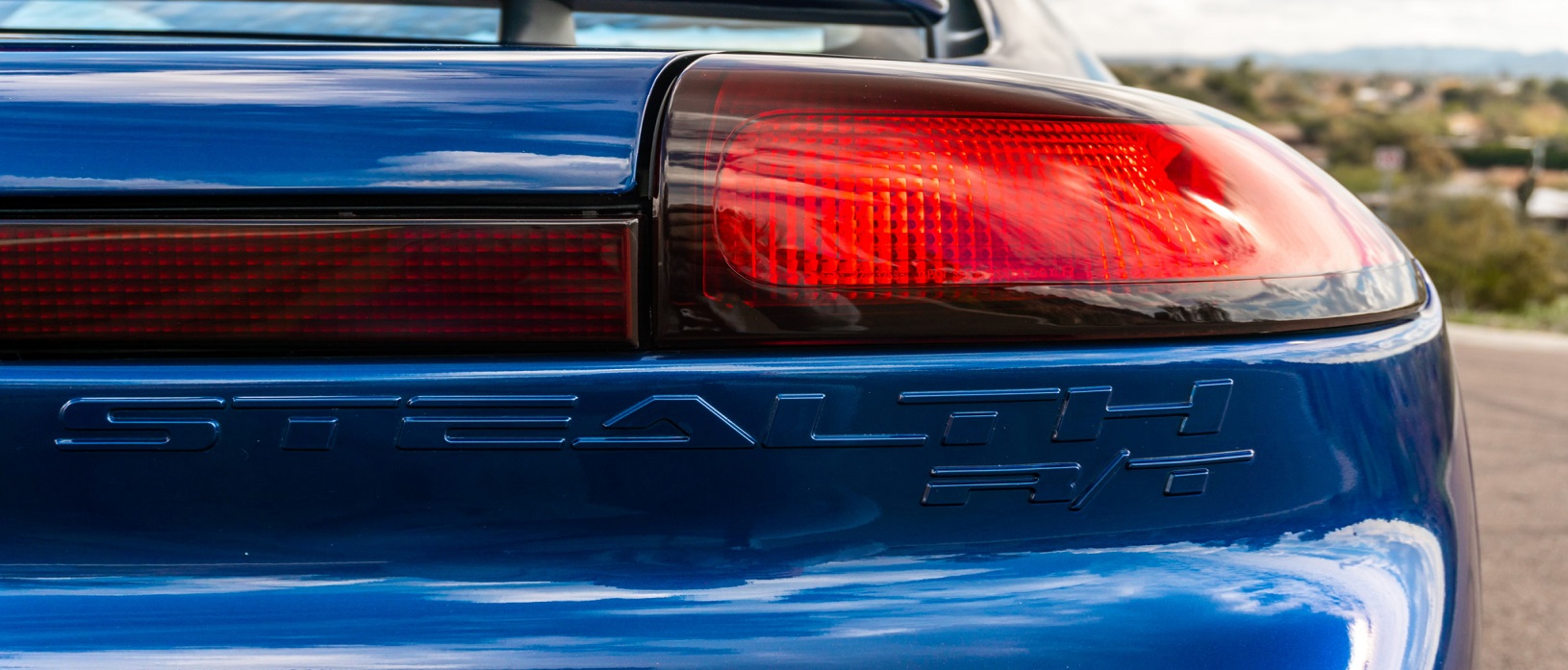 Tail light of blue Dodge Stealth