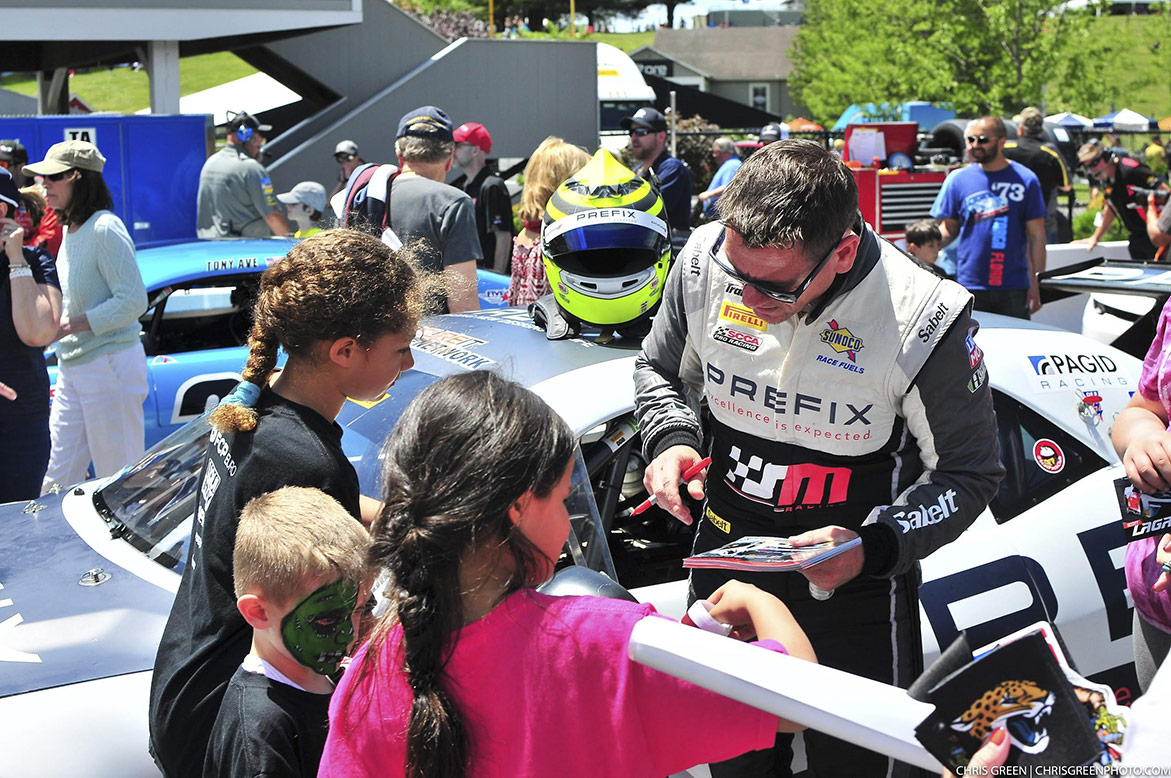 Marc Miller signing autographs for kids