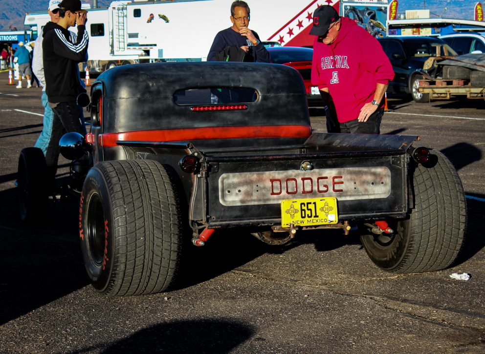 men looking at a dodge vehicle