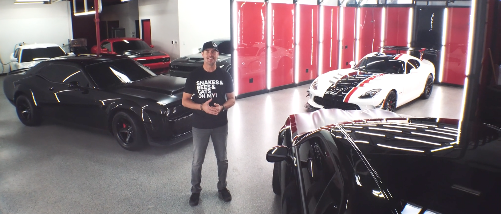 Chris Jacobs in a garage with cars