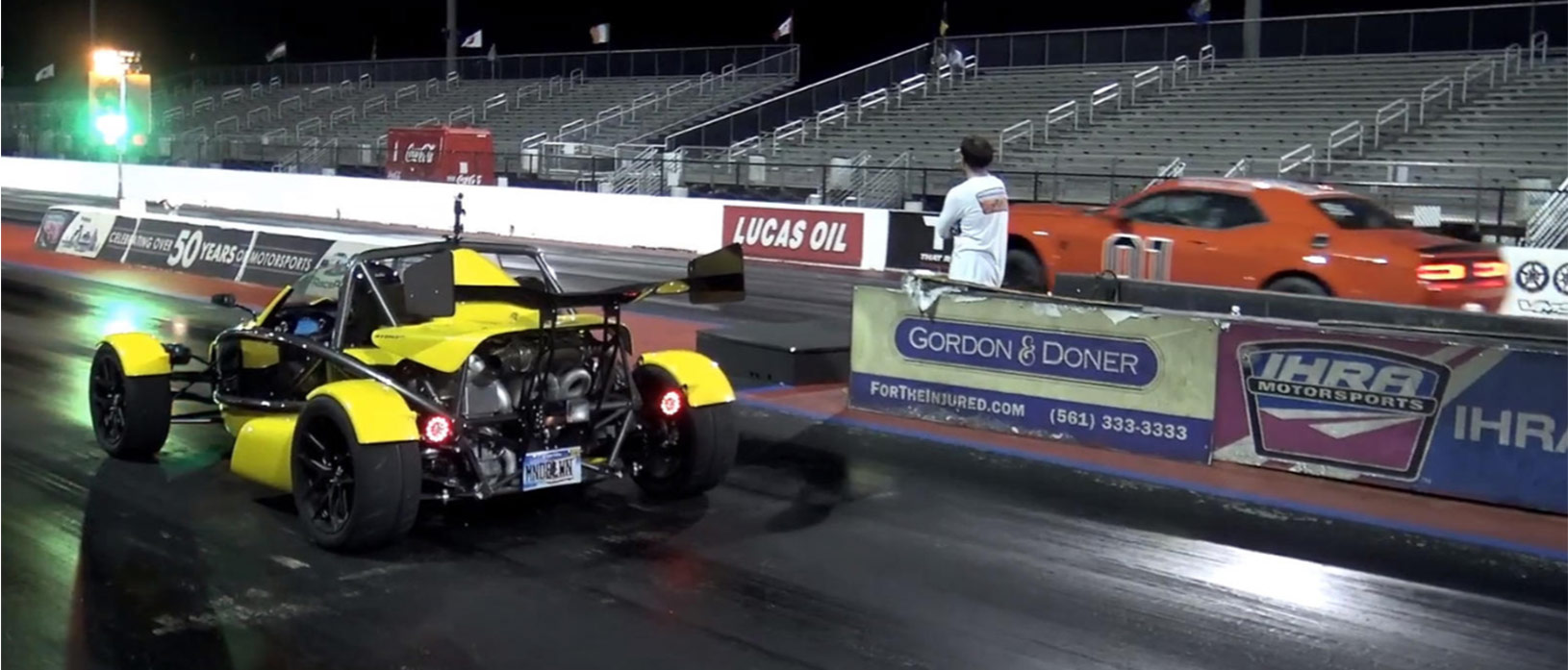 two vehicles on a drag strip