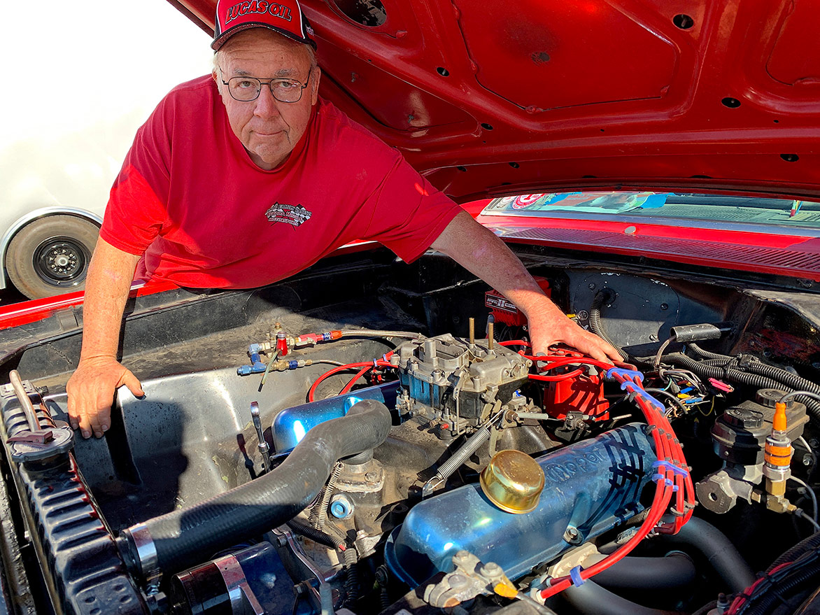 man with a car engine