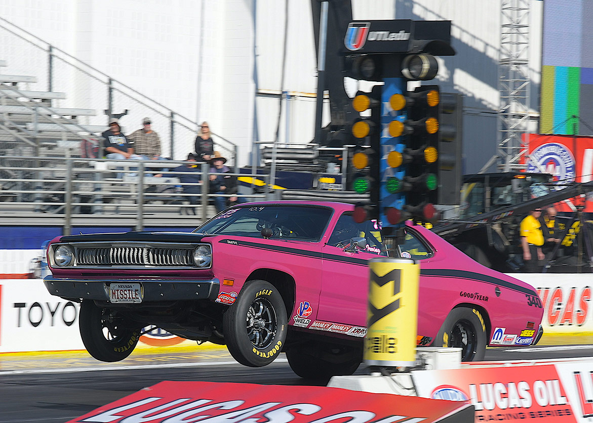 vehicle on the starting line of a drag strip