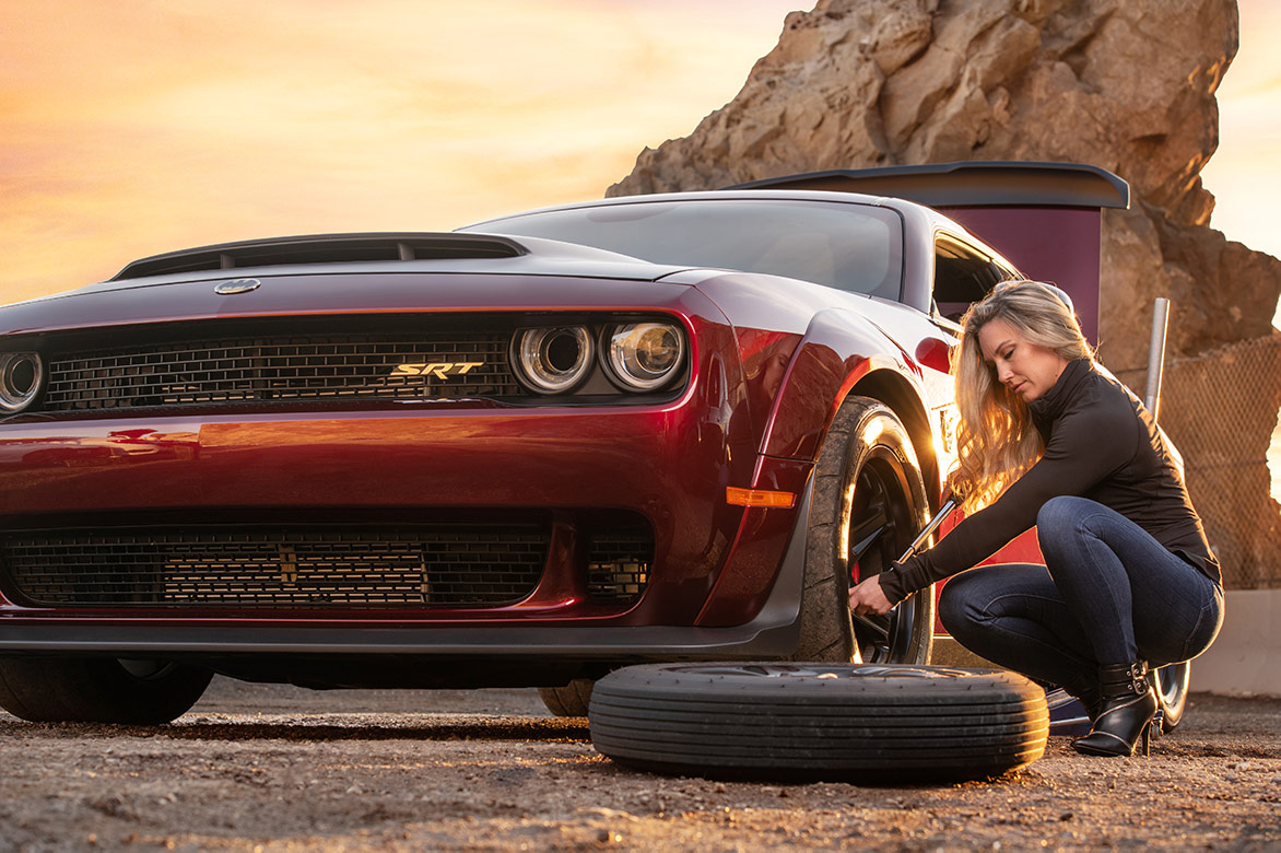 Woman changing a tire